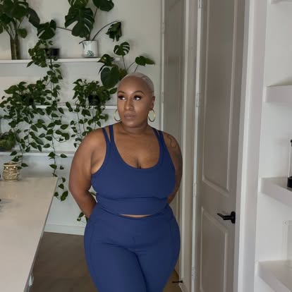Kai Michelle in a navy blue activewear set